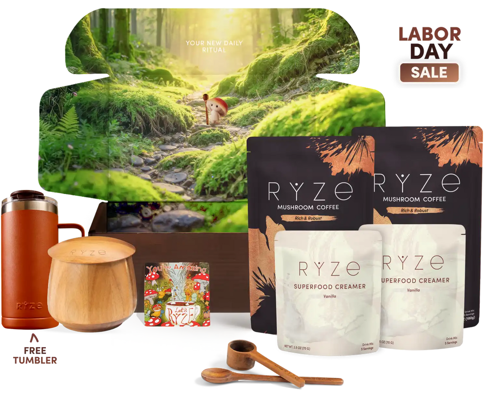Labor Day gift set featuring RYZE Mushroom Coffee with two pouches of Superfood Creamer, a wooden jar, a copper tumbler, a wooden lid, and a free tumbler offer, set against a white background with a forest-themed box.
