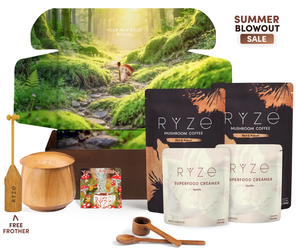 A curated product bundle for RYZE mushroom coffee featuring a forest-themed gift box, two black pouches of RYZE Mushroom Coffee, two white pouches of RYZE Superfood Creamer, wooden measuring tools, a wooden spoon, and a small magnet, arranged on a white background with promotional text overlays.